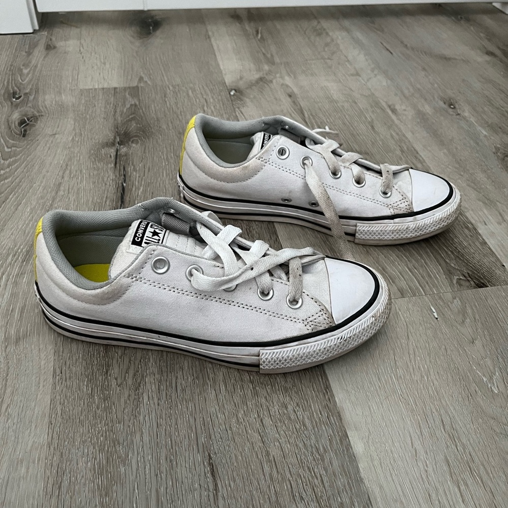 White and Yellow Converse shoes